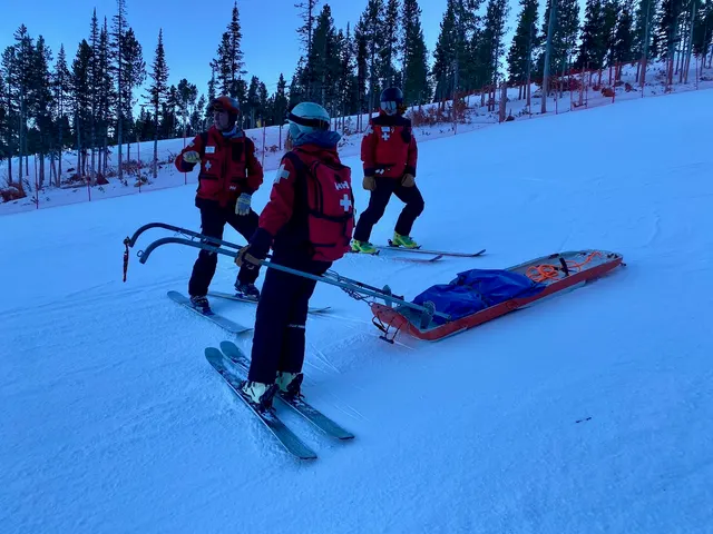 Patrollers practicing toboggan transport