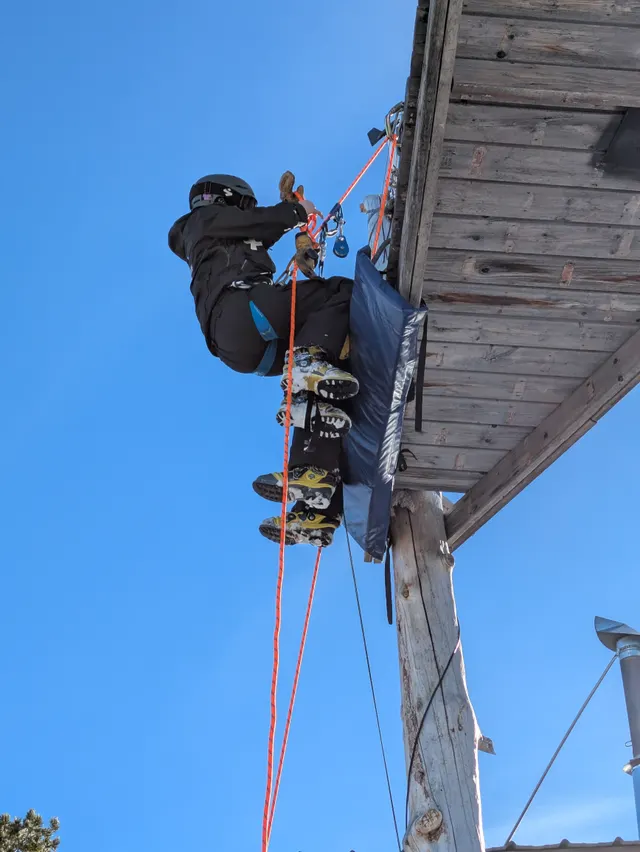 Rope training beside a mountain building