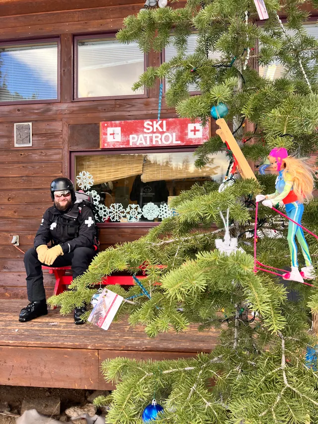 Patroller outside the ski patrol building