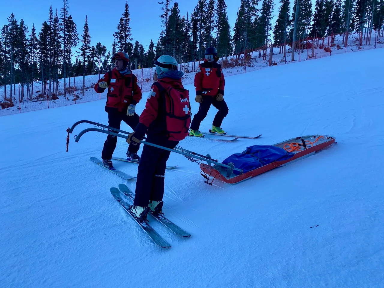 Patrollers practicing toboggan transport
